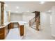A basement bar area and staircase lead to a large, open finished basement space at 3810 Urban St, Wheat Ridge, CO 80033