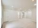 Finished basement area with neutral carpet, recessed lighting, and multiple doors to other rooms at 3810 Urban St, Wheat Ridge, CO 80033