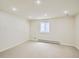 Finished basement area with carpet flooring, bright recessed lighting, and a window at 3810 Urban St, Wheat Ridge, CO 80033