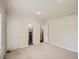 Large bedroom with neutral walls, white trim and doors, with access to a full bathroom at 3810 Urban St, Wheat Ridge, CO 80033