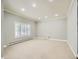 A bonus room features a neutral color scheme, shutters and recessed lighting for a bright, open space at 3810 Urban St, Wheat Ridge, CO 80033