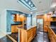 A gourmet kitchen with stainless steel appliances, custom cabinets and an island with a built-in sink at 3810 Urban St, Wheat Ridge, CO 80033