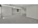 Spacious basement with neutral carpet featuring stairs, windows and multiple access points providing versatility at 6054 W Adriatic Pl, Lakewood, CO 80227
