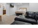 Finished basement area with a comfortable seating area, mounted TV, and access to a bathroom for convenience at 5944 S Yank Ct, Littleton, CO 80127