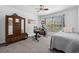 Cozy room with a comfortable bed, a desk, and a classic wardrobe at 5944 S Yank Ct, Littleton, CO 80127
