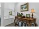 Hallway displaying charming decor with a decorative table and framed art pieces that accent the space at 5944 S Yank Ct, Littleton, CO 80127