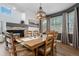 Living room with fireplace, wood floors, and an expansive window at 5944 S Yank Ct, Littleton, CO 80127