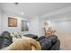 Spacious room with a comfortable couch, carpeted floors and a window at 5944 S Yank Ct, Littleton, CO 80127