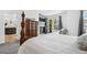 Bright main bedroom featuring a fireplace, a large window and hardwood furniture at 5944 S Yank Ct, Littleton, CO 80127