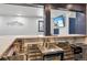 This basement wet bar features granite counters, stainless steel sink, and custom barware storage at 142 High Point Dr, Breckenridge, CO 80424