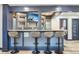 Entertain in this basement wet bar with granite counters, storage, and seating for 4 at 142 High Point Dr, Breckenridge, CO 80424