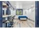 Cozy basement living space with bar, seating and a window providing scenic views at 142 High Point Dr, Breckenridge, CO 80424