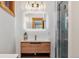 Contemporary bathroom featuring a modern vanity, glass shower, and stylish lighting fixtures at 142 High Point Dr, Breckenridge, CO 80424