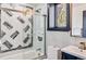 Modern bathroom with stylish tile work, glass shower doors, and mountain view at 142 High Point Dr, Breckenridge, CO 80424