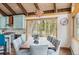 Open dining area with views and modern light fixture, flows into the kitchen and living room at 142 High Point Dr, Breckenridge, CO 80424