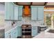 Modern kitchen with custom cabinets, stainless steel appliances, and stylish backsplash design at 142 High Point Dr, Breckenridge, CO 80424