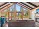 Spacious living room with a fireplace and stunning vaulted ceilings with wood beams at 142 High Point Dr, Breckenridge, CO 80424