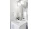 Modern bathroom with marble vanity, large mirror, and stylish fixtures at 419 Harrison St, Denver, CO 80206