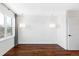 Spacious bedroom with hardwood floors and two light fixtures at 419 Harrison St, Denver, CO 80206