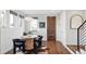 Small dining area with a round table and four black chairs at 419 Harrison St, Denver, CO 80206