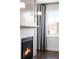 Fireplace with white mosaic tile and black insert at 419 Harrison St, Denver, CO 80206