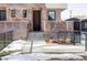 Brick front entrance with steps leading to a modern brown door at 419 Harrison St, Denver, CO 80206