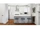 Modern white kitchen with stainless steel appliances and an island at 419 Harrison St, Denver, CO 80206