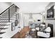 Open living room with hardwood floors and modern staircase at 419 Harrison St, Denver, CO 80206