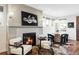 Cozy living room with a fireplace and two comfortable armchairs at 419 Harrison St, Denver, CO 80206