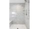 Large shower with gray tile and built-in bench at 419 Harrison St, Denver, CO 80206