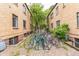 Apartment bike parking featuring brick buildings and a white gazebo at 1182 Clermont St # A202, Denver, CO 80220