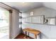 Building entryway featuring mailboxes, an intercom system, and a wooden table, offering functionality at 1182 Clermont St # A202, Denver, CO 80220