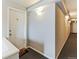 Building hallway leading to individual units, providing a clean and well-lit passageway at 1182 Clermont St # A202, Denver, CO 80220