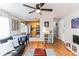 Open-concept living room with hardwood floors, access to the kitchen, and comfortable seating at 1182 Clermont St # A202, Denver, CO 80220