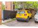 Apartment parking featuring a yellow Jeep and black covered area at 1182 Clermont St # A202, Denver, CO 80220