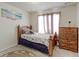 Bedroom featuring twin bed, wood furniture, and carpeted floor at 2065 E 150Th Pl, Thornton, CO 80602