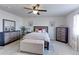 Bedroom features a ceiling fan and two dressers at 2065 E 150Th Pl, Thornton, CO 80602