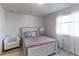 Bright bedroom features a large window with lots of natural light at 2065 E 150Th Pl, Thornton, CO 80602