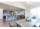 Open dining area with views of the kitchen, living room, and backyard creates a seamless flow at 2065 E 150Th Pl, Thornton, CO 80602