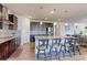 Well-appointed kitchen with a center island, stainless steel appliances, and stylish backsplash at 2065 E 150Th Pl, Thornton, CO 80602