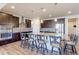 Gourmet kitchen with a large island, granite countertops, stainless steel appliances, and modern backsplash at 2065 E 150Th Pl, Thornton, CO 80602