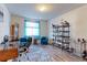 Bright living room features hardwood floors, shelving, and decor at 2065 E 150Th Pl, Thornton, CO 80602