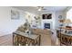 Comfortable living room features a fireplace, large window, and ample seating at 2065 E 150Th Pl, Thornton, CO 80602