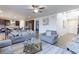 Open living area with modern decor, a view of the kitchen, and plenty of natural light at 2065 E 150Th Pl, Thornton, CO 80602