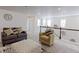 Upstairs loft featuring comfortable seating and lots of natural light at 2065 E 150Th Pl, Thornton, CO 80602