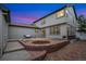 Backyard patio with seating and fire pit, ideal for outdoor entertaining and relaxing evenings at 13744 W 86Th Dr, Arvada, CO 80005