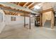 Unfinished basement showcasing ample space, exposed beams, and potential for customization at 13744 W 86Th Dr, Arvada, CO 80005