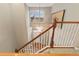 Entryway with high ceilings, modern chandelier and hardwood floors, with a view of the front door at 13744 W 86Th Dr, Arvada, CO 80005