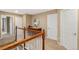 Bright hallway features neutral walls, white doors, and wood trim, offering a clean, classic aesthetic at 13744 W 86Th Dr, Arvada, CO 80005