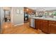 Modern kitchen with stainless steel appliances, double oven, and views of the breakfast nook at 13744 W 86Th Dr, Arvada, CO 80005